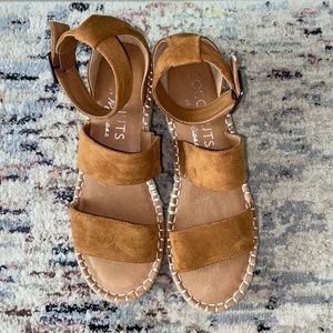 Size 7.5 never worn wedges. Brown suede straps.